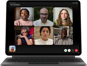 iPad Air, attached to Magic Keyboard, Black color, Group FaceTime call on screen