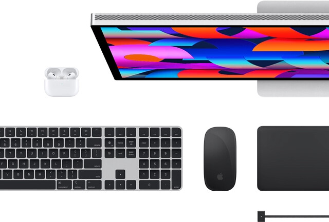 Top view of select Mac accessories: Studio Display, Magic Keyboard, Magic Mouse, Magic Trackpad, AirPods and MagSafe charging cable