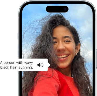 iPhone 15 showing Voiceover feature announcing the picture information: a person with wavy black hair laughing
