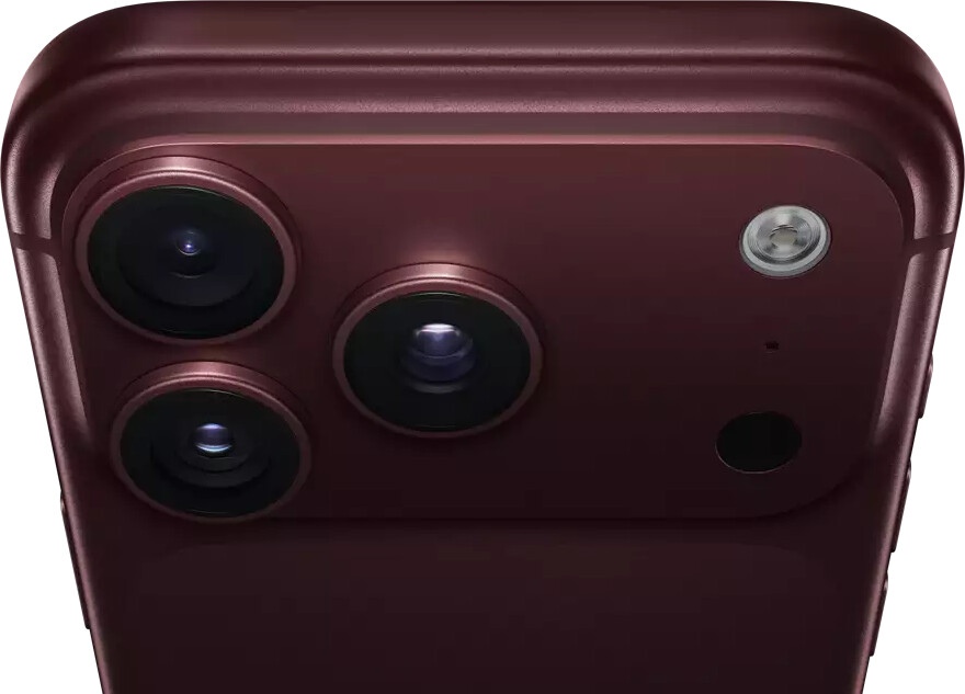 iPhone 18 Pro Max, burgundy color (dark red), back exterior, Pro Fusion camera system at top, 3 lenses, variable aperture blades partially closed, flash, microphone and LiDAR Scanner, top exterior, cellular antenna, flat sides, rounded edges